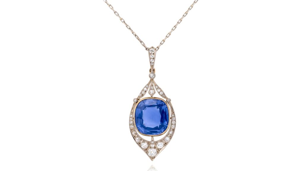 A necklace with an openwork-design pendant sports a cushion-shaped Ceylon color-change sapphire accented with circular-cut diamonds at Phillips image
