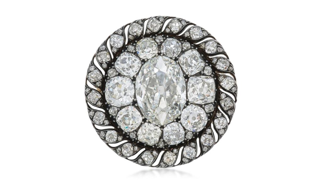 This brooch, which also functions as a pendant, dates back to the early 19th century and once belonged to Napoleon Bonaparte. It features an oval diamond weighing 13.04 carats in a surround of old mine- and mazarin-cut diamonds at Sotheby's image