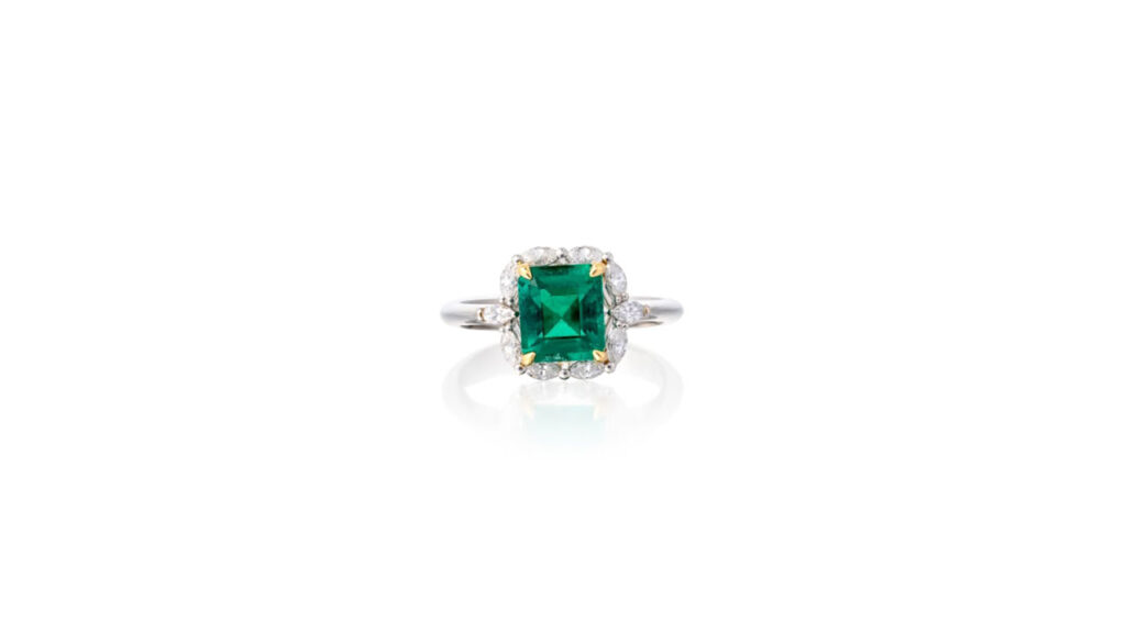This ring bears an octagonal step-cut, 1.56-carat Colombian emerald in a surround of marquise-shaped diamonds at Phillips auction image