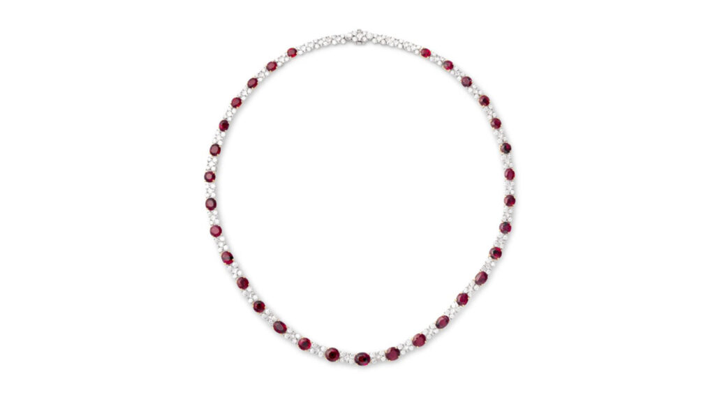 A necklace containing approximately 22 carats of oval and circular-cut Burmese rubies, accented with 7 to 9 carats of brilliant- and princess-cut diamonds at Phillips auction image