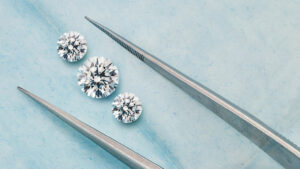 Lab-grown diamonds and tweezers image