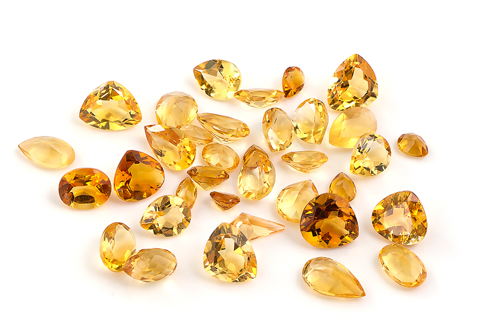Assortment of orange and yellow colored citrine gemstones image