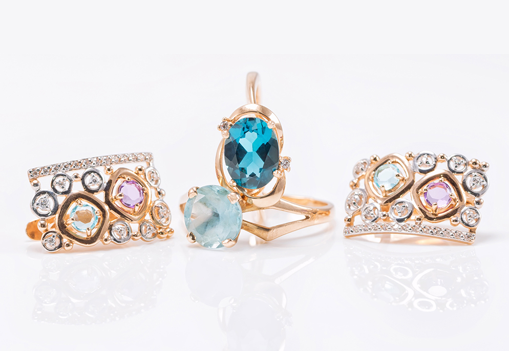 Blue Topaz gemstones set in gold rings image