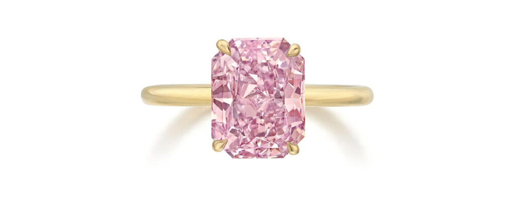 A ring featuring a radiant-cut, 3.03-carat, fancy-intense-pink diamond at Phillips image