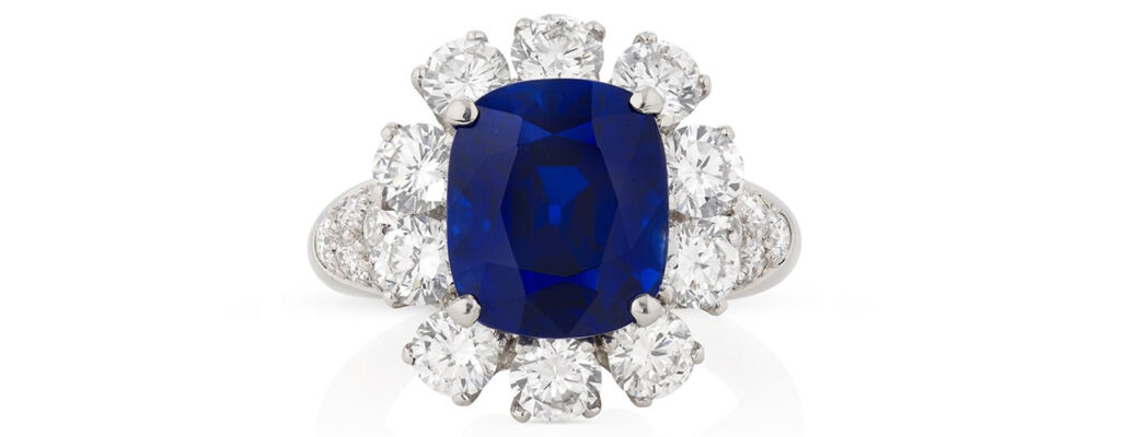 A ring from Van Cleef & Arpels centering a 7.11-carat Kashmir sapphire framed by diamonds at Phillips image