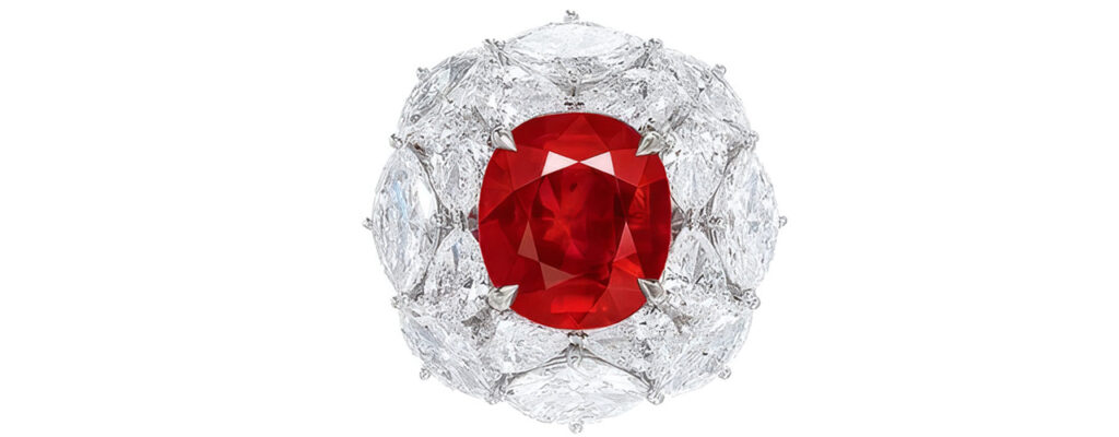 This ring with a cushion-shaped, 5.21-carat Burmese ruby in a marquise, pear and circular-cut diamond surround at Poly Auction image