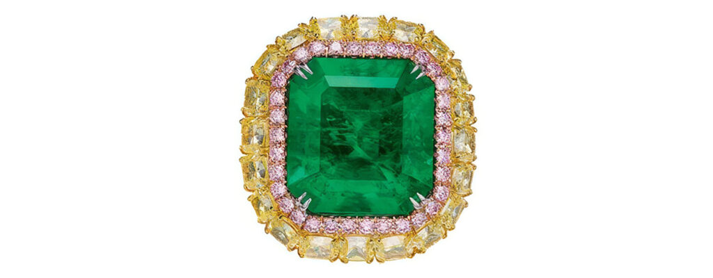 A ring featuring a rectangular-shaped, 27.16-carat Colombian Muzo emerald framed by rectangular-shaped yellow diamonds, circular-cut pink diamonds and white diamonds at Poly Auction image