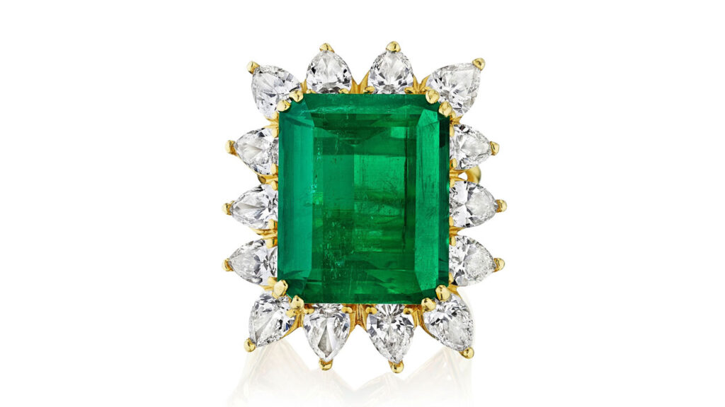 This ring centers an emerald-cut, 16.16-carat Colombian emerald with 14 pear-shaped diamonds framing it at Bonhams image