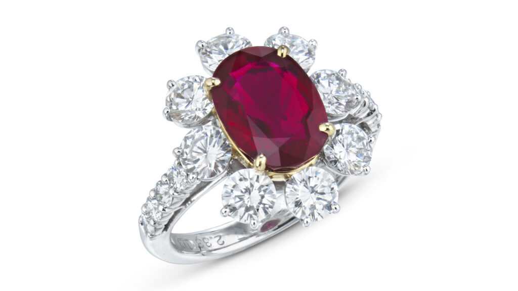 This ring centers an oval brilliant-cut, 3.34-carat Burmese ruby in a frame of eight round diamonds at Christie's image