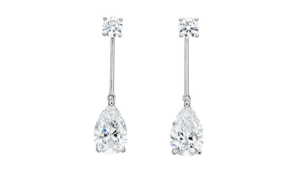 Pear-brilliant-cut, D, VVS1 diamonds of 3.25 and 3.28 carats hang from round diamonds in these earrings at Christie's image