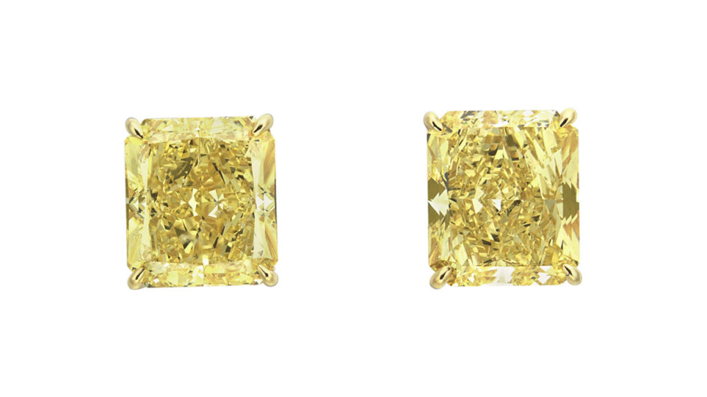 Colored-diamond earrings with two cut-cornered rectangular modified brilliant-cut stones — one a 5.12-carat fancy-intense yellow with SI1-clarity, and the other a 5.23-carat fancy-vivid yellow at Christie's image