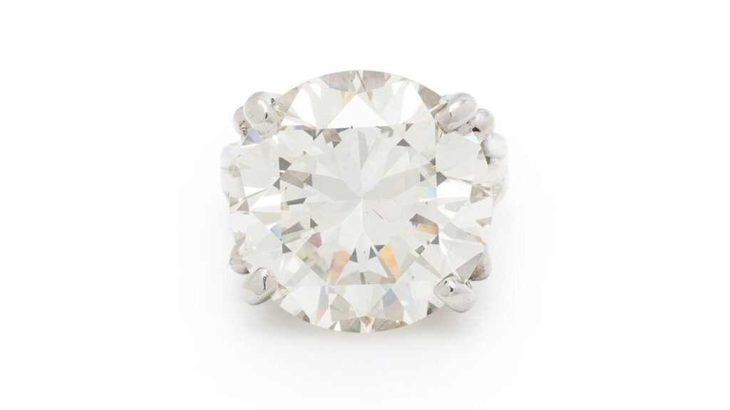 This ring centers a round brilliant-cut, 17.13-carat, N, VS2 diamond at Freeman's image