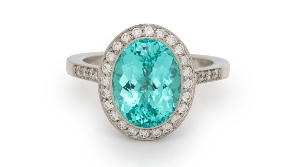 This Tiffany & Co. ring bears an oval, 4.36-carat Paraiba-type tourmaline from Mozambique, with a halo of round diamonds weighing a total of 0.61 carats at Freeman's image