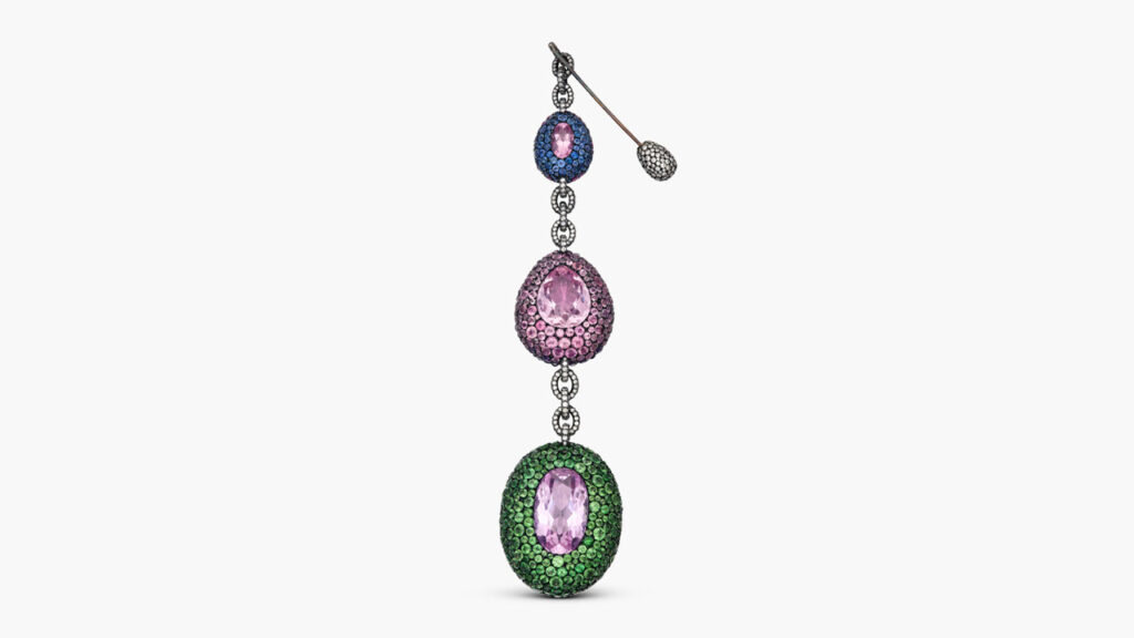 This reversible pendant, which also serves as a brooch, features oval- and pear-shaped pink topazes, as well as round rubies, diamonds, amethysts, sapphires, pink tourmalines, and demantoid garnets at Sotheby's image