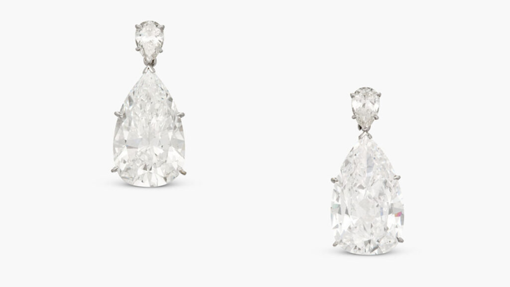 These earrings feature two large pear-shaped diamonds — one a 12.24-carat, F-color, VVS2-clarity stone, and the other an 11.68-carat, D VS2 at Sotheby's image