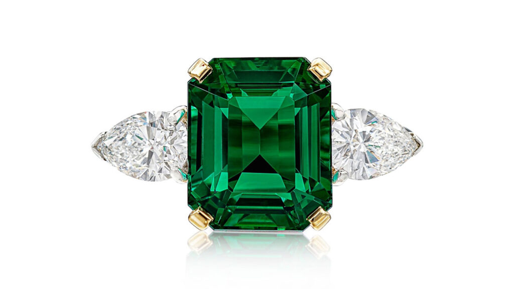 This ring from Cartier centers a step-cut, 4-carat Colombian emerald between two pear-shaped diamonds at Sotheby's image