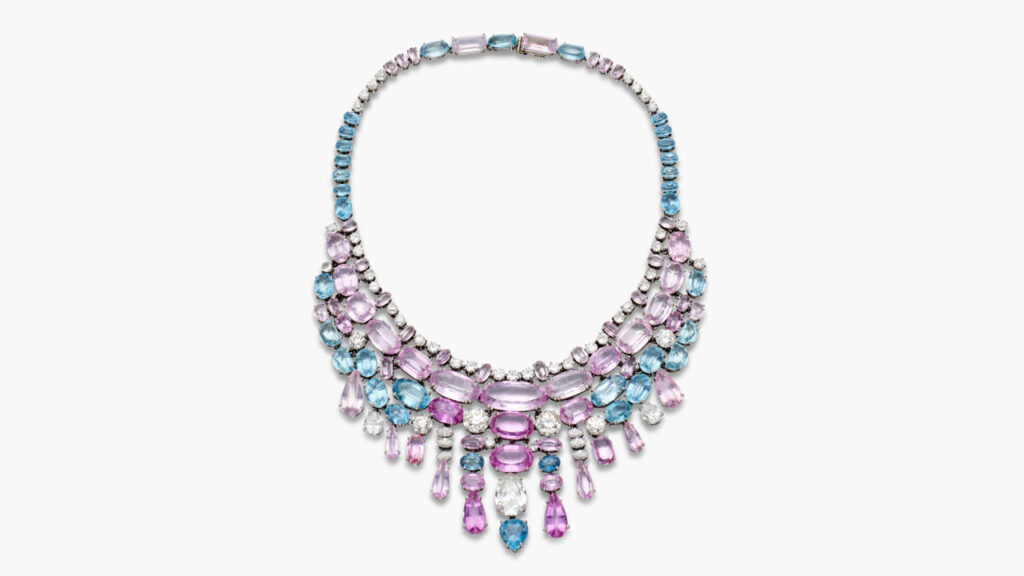 Suzanne Belperron designed this 1966 bib necklace. It contains oval-, pear-shaped and cushion-cut pink topazes and morganites, oval-, pear- and half-moon-shaped aquamarines, and marquise, pear, old European-cut and round diamonds at Sotheby's image