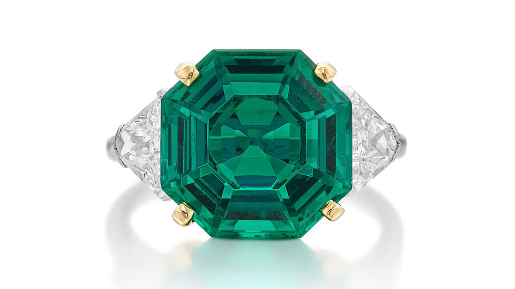 Raymond Yard is the maker of this ring, it bears an octagonal step-cut, 5.43-carat, Colombian emerald as the center stone, with triangle diamond side stones at Sotheby's image