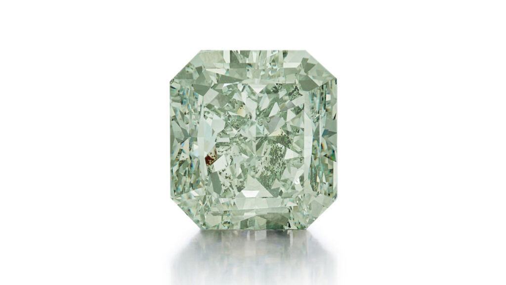 An unmounted cut-cornered rectangular mixed-cut, 5.23-carat, fancy-intense-green, SI2 diamond at Sotheby's image