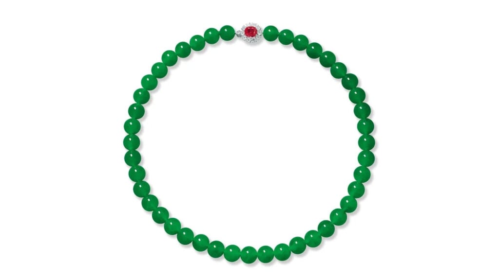 A necklace bearing 43 jadeite beads connected by a ruby and circular-cut diamond clasp at Poly Auction image