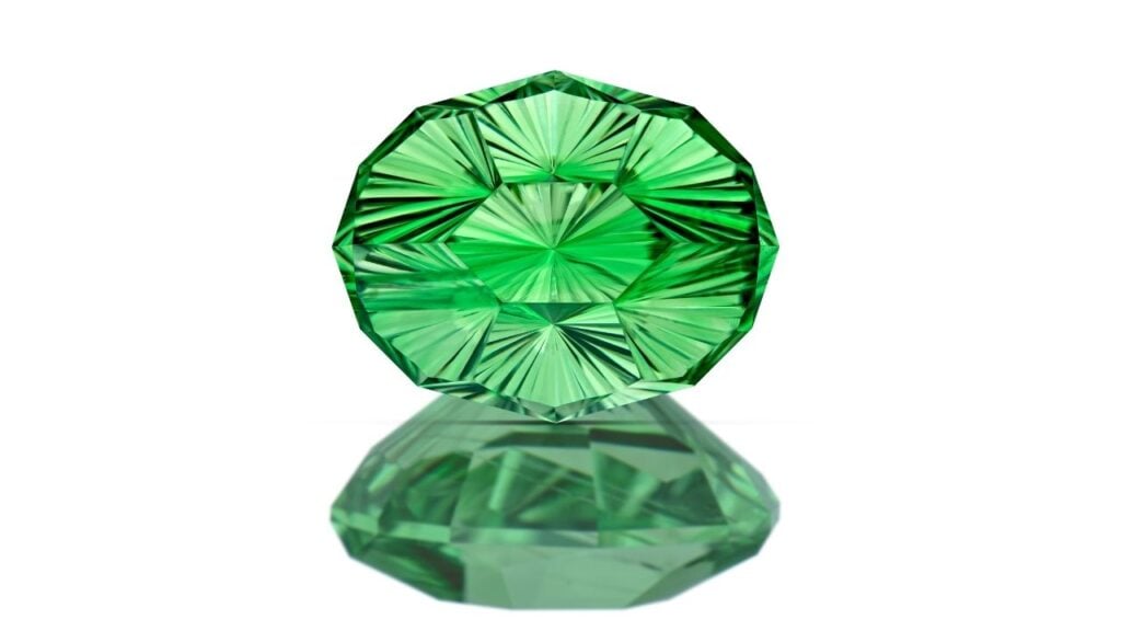 An oval concave-cut, color-zoned tsavorite garnet weighing 3.67 carats image