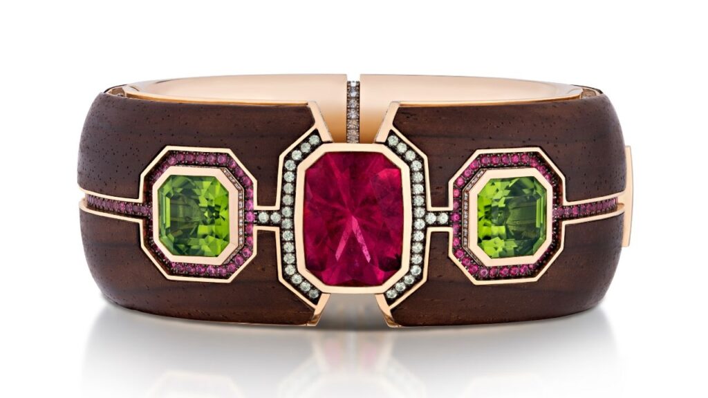 The Elements bracelet in 18-karat yellow gold, platinum, and cocobolo wood with a pink tourmaline, peridot, spinels, demantoid garnets, and diamonds image