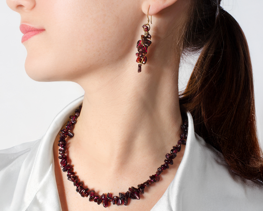 Garnet gemstones necklace on a model image
