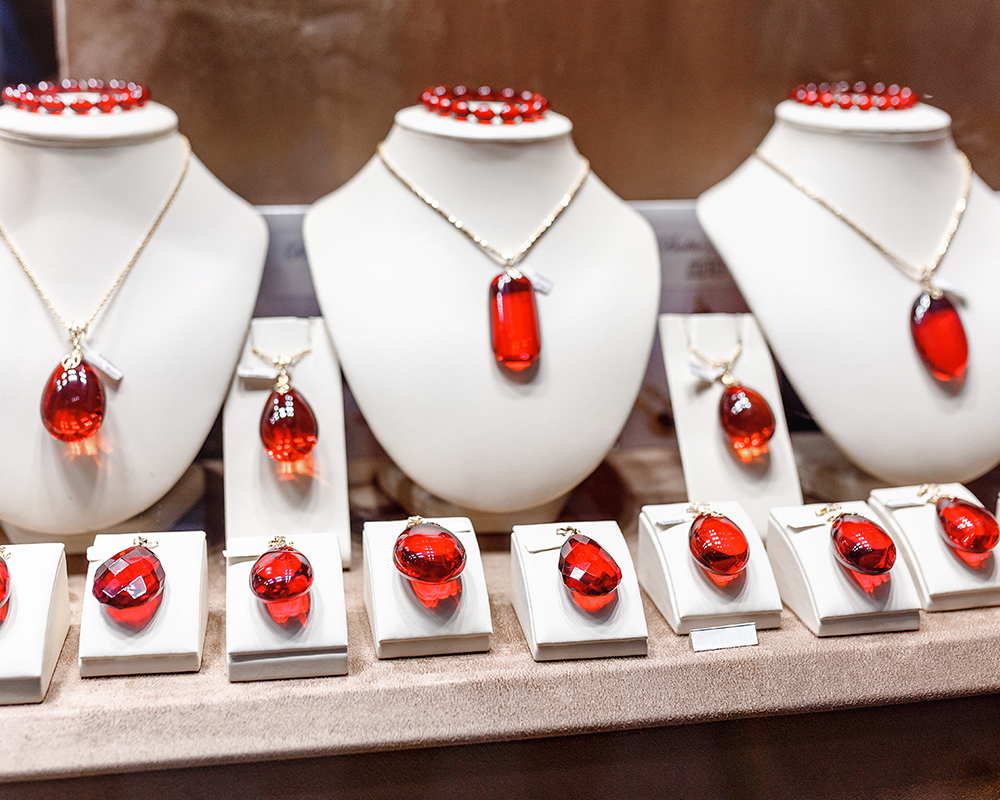 Jewelry store display of orange-red garnet gemstones image