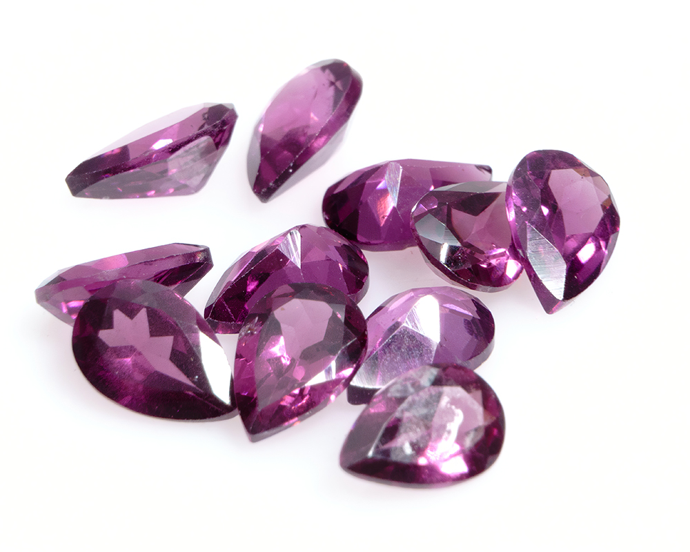 Pear shaped purple rhodolite garnet gemstones image