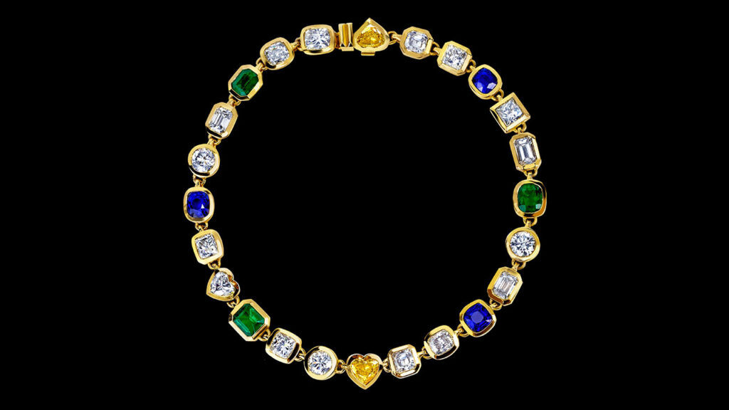 This necklace comprises 17 diamonds weighing around 5 carats each, with colors ranging from J to L and clarity from VS2 to SI1, as well as three Colombian emeralds totaling 16.48 carats and three Sri Lankan blue sapphires weighing a combined 21.48 carats at Joopiter image