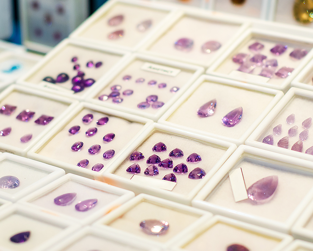 Jewelry store’s display of different colored amethyst gems image
