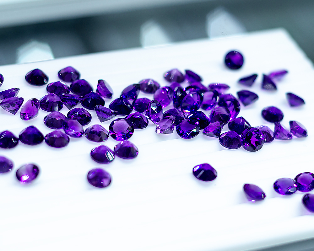 Faceted deep purple amethyst gemstones for sale image