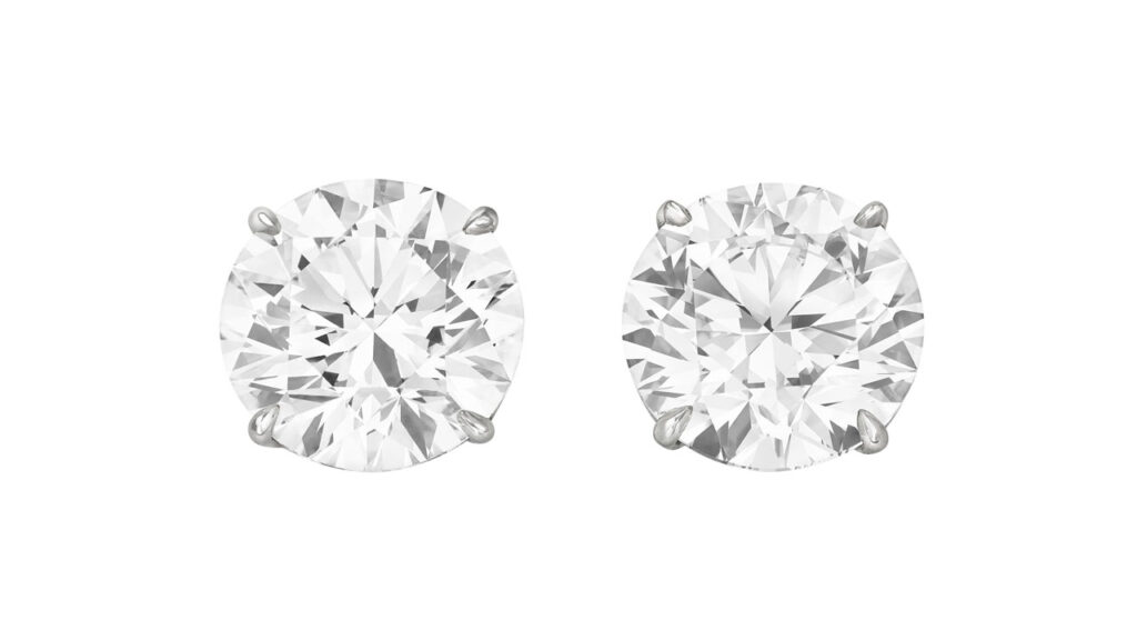 A pair of stud earrings, these showcase round brilliant-cut, 5.01-carat diamonds, with one a D, VS2 and the other an E, VS1 at Christie's