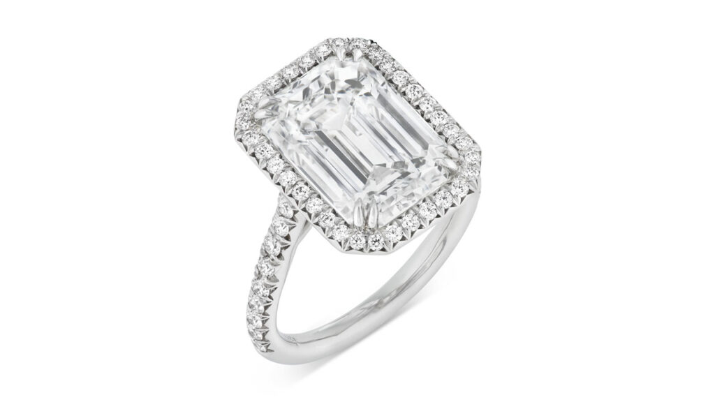 This Tiffany ring centers an emerald-cut, 6.03-carat, G, VS1 diamond, and a surround of round diamonds at Christie's