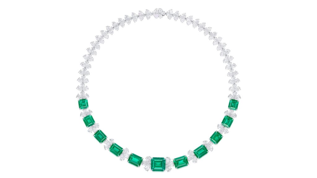 This necklace comprises 11 graduated step-cut Colombian emeralds with a total weight of 45.94 carats, spaced by pear-shaped diamonds at Phillips image