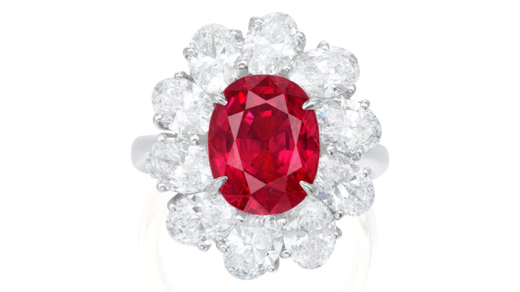This ring bears an oval, 5.39-carat Burmese ruby framed by oval diamonds at Phillips image