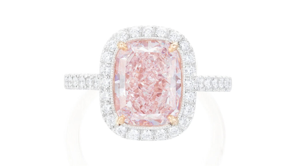 This ring centers a round-cornered rectangular modified brilliant-cut, 4.05-carat, fancy-light-pink diamond in a brilliant-cut diamond surround at Phillips image