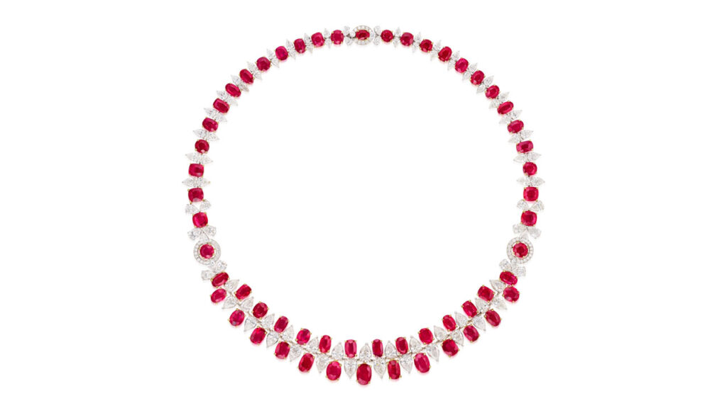 This necklace bears 56.98 carats of oval and cushion-shaped Burmese rubies, spaced by pear-shaped diamonds at Phillips image