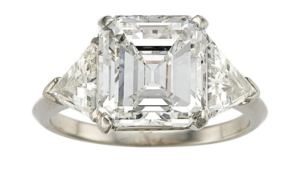 Estimate: $80,000 to $100,000
An emerald-cut, 4.71-carat, F, VS1 diamond between two calf’s head-cut diamonds at Heritage Auctions image