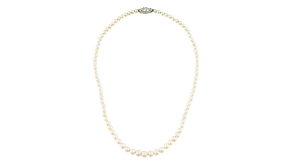A necklace featuring 83 rounded cream-colored pearls and diamond clasp at Sotheby's image