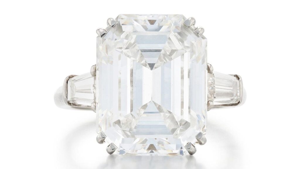 This Harry Winston ring bears a rectangular cut-cornered, 7.83-carat, E-color, VS1-clarity diamond between baguette-cut stones at Sotheby's image