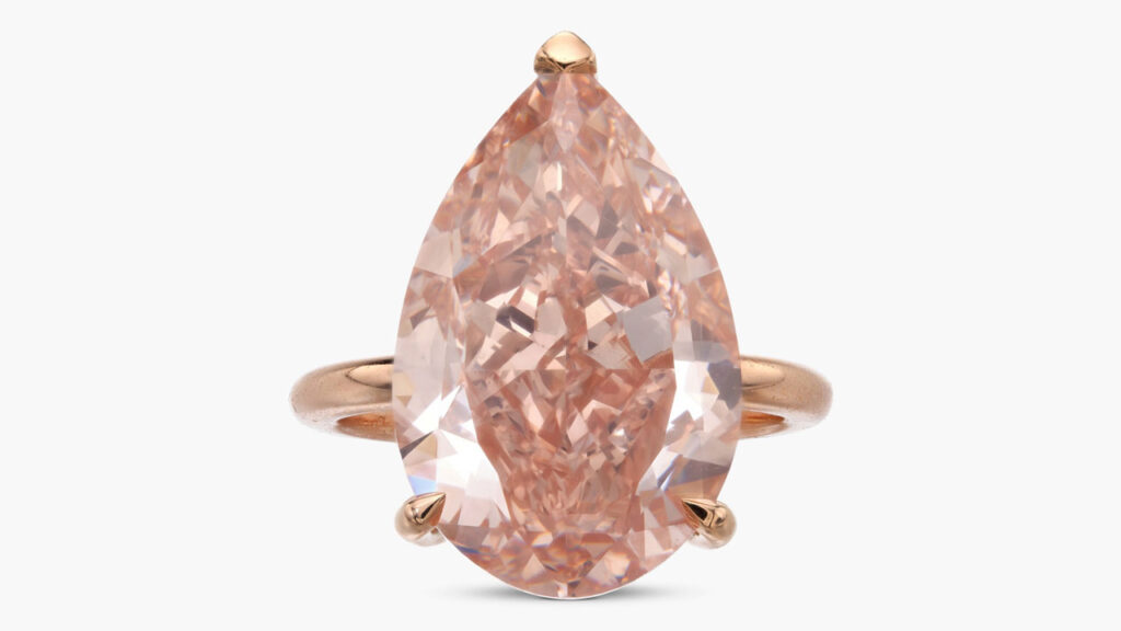 A ring centering a pear-shaped, 14.60-carat, fancy-brownish-orangey-pink, VS1-clarity diamond, with its gallery including brilliant-cut diamond accents at Sotheby's image