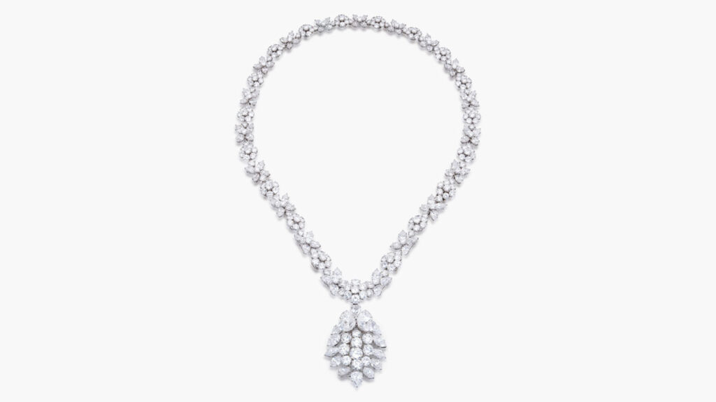 A Van Cleef & Arpels necklace sporting a detachable pendant that can be worn as a brooch, designed as a cluster of pear- and marquise-shaped and brilliant-cut diamonds hanging from a subtly graduated necklace composed of alternating clusters of brilliant-cut and pear-shaped diamonds at Sotheby's image