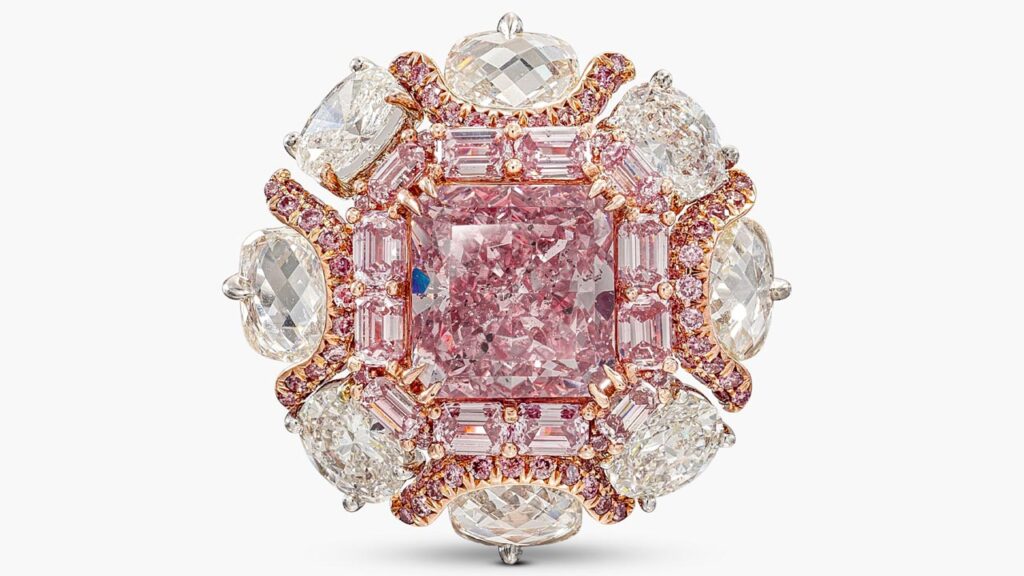 A ring, bearing a cut-cornered square modified brilliant-cut, 4.63-carat, fancy-intense-purplish-pink, I1 diamond within a surround of step-cut diamonds of pink tint at Sotheby's image