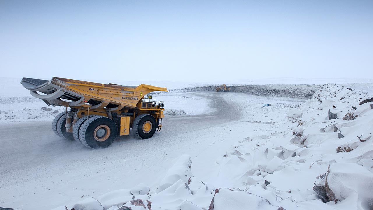 Trucks hauling ore at the Gahcho Kué mine in Canada by Mountain Province image