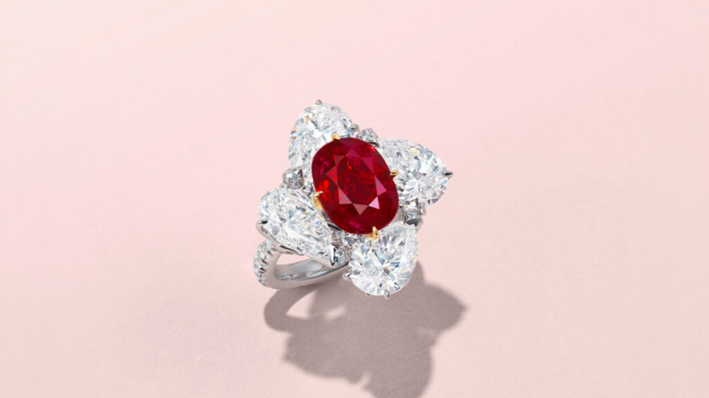 An oval brilliant-cut, 5.07-carat Burmese ruby is the star of this ring. It is framed by four pear brilliant-cut diamonds weighing 1.70, 1.84, 2 and 2.02 carats, and has round diamonds on the band at Christie's image