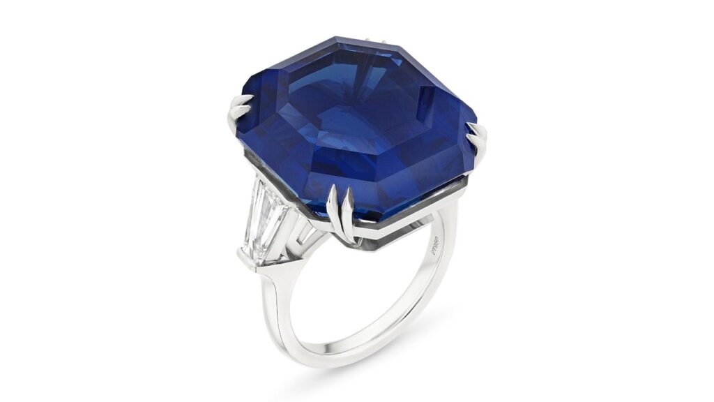 A ring starring an octagonal step-cut, 41.29-carat Ceylon sapphire flanked by tapered baguette-cut diamonds at Christie's image