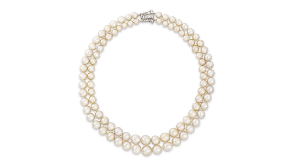 A necklace featuring two strands of graduated natural pearls and old- and baguette-cut diamonds, created around 1920 at Christie's image