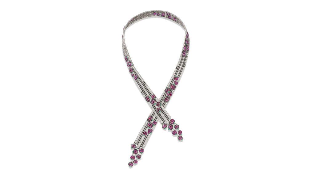 A Boucheron Art Deco necklace, created in the 1920s, bears rubies, emeralds, onyx baguettes, and old- and single-cut diamonds. It has four detachable sections and can be worn long or as a choker and two bracelets at Christie's image