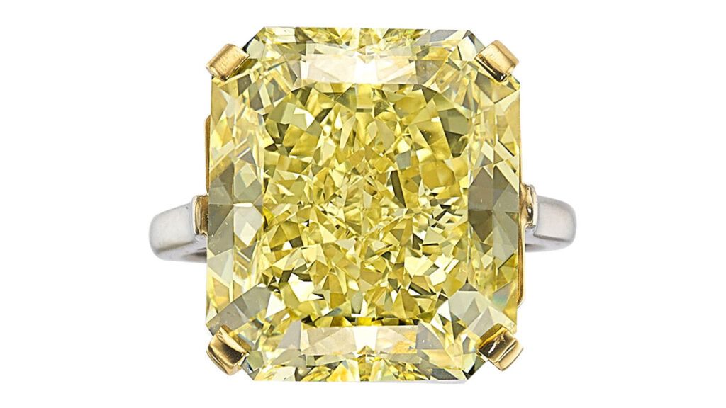 A Cartier ring bearing a cut-cornered rectangular modified brilliant-cut, 20.03-carat, fancy-intense-yellow, VVS2-clarity diamond at Heritage Auctions image